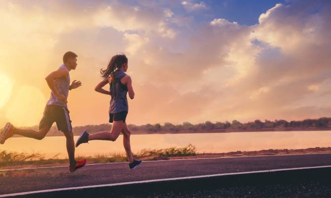 A couple sprinting down a road, training themselves so that they’re ready to race the next marathon together.