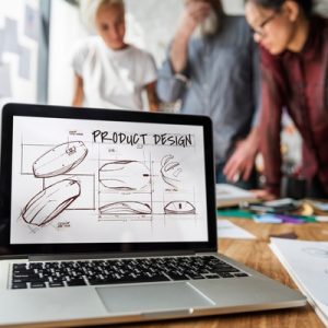 A diverse team of product designers is looking at their product design mockups and selecting colors.